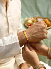 Personalized Gold Ganesha Rakhi for Brother with Engraved Name