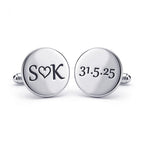 Silver cufflinks with 'SOK' and '31.5.25' engraving on a white background