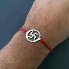 Silver Swastik Rakhi on Red Thread