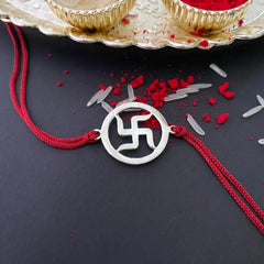 Silver Swastik Rakhi on Red Thread